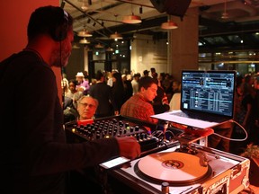 A DJ plays at the opening of the Queen St. Fare food hall on Queen Street in Ottawa on Thursday, Dec. 6, 2018.