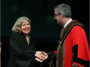 Theresa Kavanagh, councillor for Ward 7, Bay, is congratulated by Ottawa Mayor Jim Watson prior to signing the Oath of Office on Dec. 3.