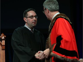 Glen Gower, Councillor for Ward 6 Stittsville is congratulated by Ottawa Mayor Jim Watson prior to signing the Oath of Office during the Inauguration ceremony Dec. 3.