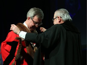 Jim Watson receives the Chain of Office by Rick O'Connor, City Clerk and Solicitor, during the inauguration ceremony for Ottawa's new City Council, December 03, 2018.