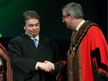 Rick Chiarelli, Councillor for Ward 8 College is congratulated by Ottawa Mayor Jim Watson prior to signing the Oath of Office during the Inauguration ceremony for Ottawa's new City Council, December 03, 2018.