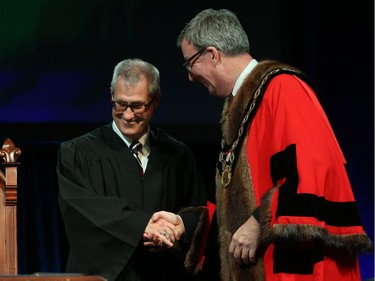 Keith Egli, Councillor for Ward 9 Knoxdale-Merivale is congratulated by Ottawa Mayor Jim Watson prior to signing the Oath of Office during the Inauguration ceremony for Ottawa's new City Council, December 03, 2018.