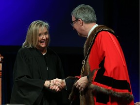 Diane Deans, Councillor for Ward 10 Gloucester-Southgate is congratulated by Ottawa Mayor Jim Watson prior to signing the Oath of Office during the Inauguration ceremony for Ottawa's new City Council, Dec. 3, 2018.