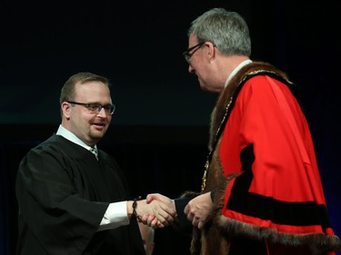 Stephen Blais, Councillor for Ward 19 Cumberland is congratulated by Ottawa Mayor Jim Watson prior to signing the Oath of Office during the Inauguration ceremony for Ottawa's new City Council, December 03, 2018.