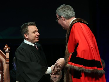 Scott Moffatt, Councillor for Ward 21 Rideau-Goulbourn is congratulated by Ottawa Mayor Jim Watson prior to signing the Oath of Office during the Inauguration ceremony for Ottawa's new City Council, December 03, 2018.