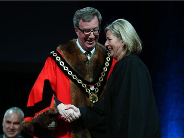 Carol Anne Meehan, Councillor for Ward 22 Gloucester-South Nepean is congratulated by  Mayor Jim Watson prior to signing the oath of office during the Inauguration ceremony for Ottawa's new city council, Dec. 3, 2018.