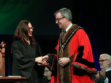 Laura Dudas, Councillor for Ward 2 Innes is congratulated by Ottawa Mayor Jim Watson prior to signing the Oath of Office during the Inauguration ceremony for Ottawa's new City Council, December 03, 2018.