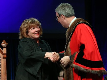 Jan Harder, Councillor for Ward 3 Barrhaven is congratulated by Ottawa Mayor Jim Watson prior to signing the Oath of Office during the Inauguration ceremony for Ottawa's new City Council, December 03, 2018.
