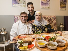Issam Aoude with his wife Mayssaa Chaltaf and son Karim Aoude at their Semsem restaurant. August 16, 2018. Errol McGihon/Postmedia