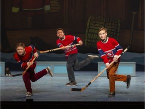 Jaime MacLean, left, Liam Wignall and Oliver Neudorf, right, in a scene from The Hockey Sweater: A Musical, on at the National Arts Centre until Dec. 23.