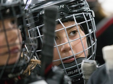 Mallea McMullin of the Nepean Wildcats in the Girls Atom AA division listens to her coach before playing against the Whitby Wolves as the annual Bell Capital Cup hockey tournament for Peewee and Atom level players gets underway at the Bell Sensplex and various arenas across the city.
