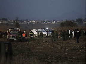 Emergency rescue personnel, the army and the police arrive to the scene of a helicopter crash where Puebla Gov. Martha Erika Alonso and her husband Rafael Moreno Valle, a former Puebla governor, died near Puebla City, southeast of Mexico City on Monday, Dec. 24, 2018. The husband-and-wife political power couple died Christmas Eve in the crash, Mexican officials reported.