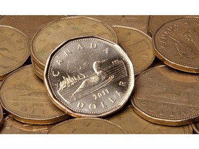 Canadian dollars are pictured in Vancouver, September 22, 2011.