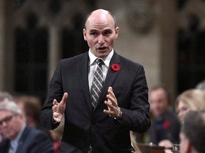 The Trudeau Liberals haven't shut the door on crafting a guaranteed minimum income program in its ongoing search for tools to help workers adapt to an unsteady and shifting labour market. Minister of Families, Children and Social Development Jean-Yves Duclos rises during Question Period in the House of Commons on Parliament Hill in Ottawa on Friday, Oct. 26, 2018.