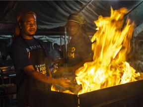 Fish grilling at Oistins Fishing Village during the opening night of the 9th annual Barbados Food and Rum Festival.