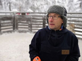 Reindeer herder Seppo Koivisto stands in a reindeer farm in Finnish Lapland, in Rovaniemi, Finland, Thursday Dec. 13 2018. To keep track of their animals in Lapland, Northern Finland's vast and remote snow-covered forests, reindeer herders are turning to technology by fitting them with internet-connected collars.