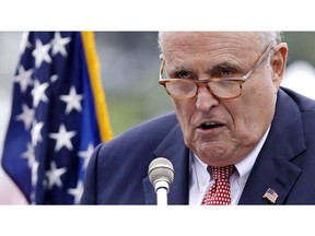 Rudy Giuliani, an attorney for President Donald Trump, addresses a gathering during a campaign event for Eddie Edwards, who is running for the U.S. Congress in New Hampshire, in Portsmouth, N.H., Wednesday, Aug. 1, 2018.