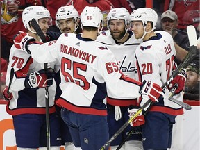 Washington Capitals right- winger Brett Connolly (10) celebrates his goal against the Ottawa Senators with teammates during the first period at the CTC on Saturday Dec. 22, 2018.