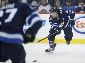 Winnipeg Jets' Mark Scheifele (55) makes the pass to Nikolaj Ehlers (27) who shoots for the tying goal during second period NHL action against the Tampa Bay Lightning, in Winnipeg on Sunday, Dec. 16, 2018.