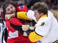 Senators winger Bobby Ryan, left, fights Predators centre Kyle Turris in the second period of Monday's game.