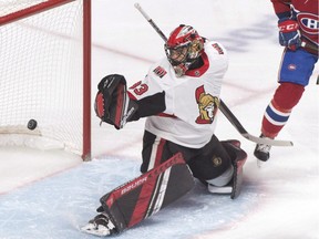 Ottawa Senators goaltender Mike McKenna looks back at the puck after Montreal Canadiens' Matthew Peca scores during the first period on Saturday, Dec. 15, 2018.