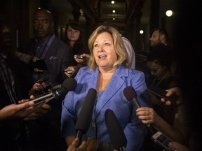 Lisa Thompson, Ontario's Minister of Education scrums with reporters following Question Period, at the Queens Park Legislature, in Toronto on Thursday, August 9, 2018.