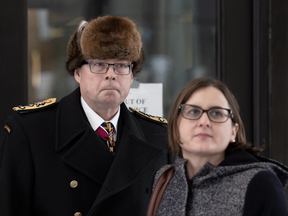 Suspended Vice-Admiral Mark Norman and one of his lawyers, Christine Mainville, outside court in November 2018.