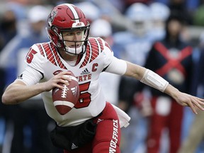 North Carolina State quarterback Ryan Finley (15) scrambles against North Carolina during the first half of an NCAA college football game in Chapel Hill, N.C., Saturday, Nov. 24, 2018.