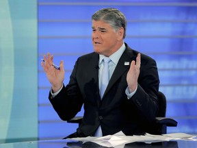 FILE - In this July 26, 2018, file photo, Fox News talk show host Sean Hannity talks during an interview during a taping of his show in New York. Bad news for President Donald Trump also means a tough time for his biggest media backer, Fox News' Hannity. His ratings are down since the election, and his rivals are up. Still, Fox will finish as the top-rated network in all of basic cable for the third straight year.