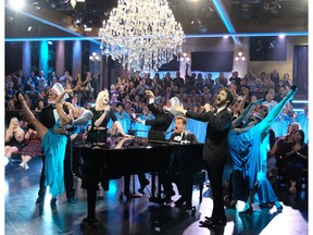 This Sept. 26, 2018 image released by CBS shows Sophie Turner, left, and Josh Groban, right, performing "Baby Shark" with host James Corden on "The Late Late Show with James Corden," in Los Angeles. The viral kid music video "Baby Shark" has taken a big bite out of the culture worldwide, and there's more to come for Christmas. New toys tied to the snappy song sold out in pre-sale ahead of the holiday on Amazon, with third-party sellers jacking up the prices to $100 and more. Celebrities have hopped on board with their own versions of the song and dance, complete with all the shark hand gestures.