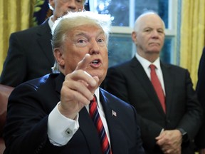 FILE - In this Oct. 23, 2018, photo, President Donald Trump speaks following a ceremony signing the "America's Water Infrastructure Act of 2018" into law in the Oval Office at the White House in Washington. The greatest threat to President Donald Trump's re-election bid may not be the slew of investigations closing in on his Oval Office but a possible economic slowdown. And the president knows it. The Dow Jones Industrial Average fell again Monday, Dec. 17, the latest dip in the roller coaster markets amid the strain of Trump's trade war, rising interest rates and worries about a slowing global economy.