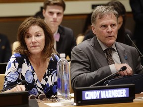 Fred Warmbier, right, and Cindy Warmbier, parents of Otto Warmbier, wait for a meeting at the United Nations headquarters.  A federal judge has ordered North Korea to pay more than $500 million in a wrongful death suit filed by the parents of Otto Warmbier, an American college student who died shortly after being released from that country.