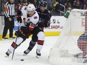 Ottawa Senators' Matt Duchene, left, carries the puck behind the net as Columbus Blue Jackets' Alexander Wennberg, of Sweden, defends during the third period of an NHL hockey game Monday, Dec. 31, 2018, in Columbus, Ohio.