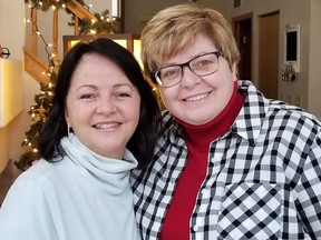 Tina White (left), of Fredericton, N.B., poses for a photo with her long-lost biological sister, Susan Rice, after the two of them met for the first time in Chicago on Christmas Day.