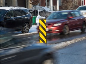 Flexi-board traffic calming signs along Holland Avenue, just south of Byron. How do we solve our speeding problem?