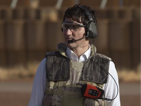 Canadian Prime Minister Justin Trudeau is seen as he watches a medical evacuation demonstration during a visit to Canadian Armed Forces personnel serving on the United Nations Multidimensional Integrated Stabilization Mission in Gao, Saturday, December 22, 2018.