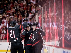 Canada's Owen Tippett, from left to right, Jared McIsaac and Maxime Comtois celebrate Comtois' goal against the Czech Republic during first period IIHF world junior hockey championship action in Vancouver, on Saturday December 29, 2018.