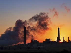 FILE - In this July 27, 2018, file photo, the Dave Johnson coal-fired power plant is silhouetted against the morning sun in Glenrock, Wyo. The Trump administration on Friday targeted an Obama-era regulation credited with helping dramatically reduce toxic mercury pollution from coal-fired power plants, saying the benefits to human health and the environment may not be worth the cost of the regulation. The 2011 Obama administration rule, called the Mercury and Air Toxics Standards, led to what electric utilities say was an $18 billion clean-up of mercury and other toxins from the smokestacks of coal-fired power plants.