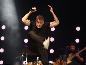 FILE - In this file photo dated Saturday, Nov. 11, 2017, musician Johnny Clegg performs on stage during his own farewell concert in Johannesburg. The 65-year old Clegg who has survived pancreatic cancer for the last few years, says in an interview broadcast Tuesday Dec. 18, 2018, he has a greater awareness of mortality and enjoys feeding birds in his garden.