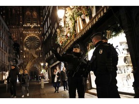 French gendarmes patrol in the streets of the city of Strasbourg, eastern France, following a shooting, Wednesday, Dec. 12, 2018. Police union officials identified the suspected assailant as Frenchman Cherif Chekatt, a 29-year-old with a thick police record for crimes including armed robbery and monitored as a suspected religious radical by the French intelligence services.