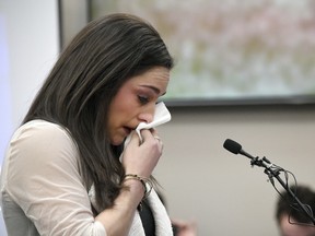 Olympic gold medalist Jordyn Wieber cries as she gives her victim impact statement in Lansing, Mich., during the fourth day of sentencing for former sports doctor Larry Nassar,.