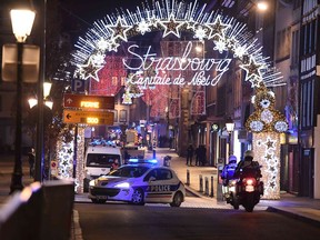 A police car drives in the streets of Strasbourg, eastern France, after a shooting breakout, on December 11, 2018. - A shooting in Strasbourg made one death and ten blessings, according to a new balance sheet.