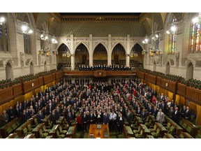 Members of the House of Commons pose for a photo in the chamber before Question Period in the House of Commons Wednesday, December 12, 2018 in Ottawa. Centre block is slated to close for renovations following the fall session.