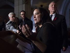 Minister of Border Security and Organized Crime Reduction Bill Blair looks on as Minister of Justice and Attorney General of Canada Jody Wilson-Raybould respond to a question about drinking and driving laws during a news conference in Ottawa, Tuesday December 4, 2018.