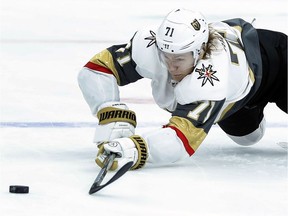 FILE - In this Nov. 1, 2018, file photo, Vegas Golden Knights' William Karlsson, of Sweden, reaches for a loose puck during the first period of an NHL hockey game against the St. Louis Blues, in St. Louis. Hindsight is 43/35 for the Columbus Blue Jackets. That's how many goals and assists William Karlsson put up for the Vegas Golden Knights after the Blue Jackets let him go in the expansion draft.