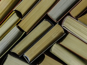 a stack of colorful books in a library or a room