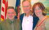 Arthur Milnes, left, and his wife, Alison, with former president George H.W. Bush in Houston a few years back.
