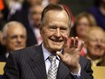 Former U.S. President George H.W. Bush acknowledges the audience on day two of the Republican National Convention (RNC) at the Xcel Energy Center in St. Paul, Minnesota, U.S., on Tuesday, Sept. 2, 2008.