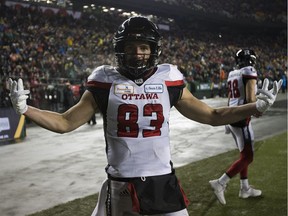 Ottawa Redblacks Julian Feoli-Gudino (83) celebrates his touchdown against the Calgary Stampeders during the 106th Grey Cup game on Sunday, Nov. 25, 2018, in Edmonton. Feoli-Gudino was one of three players who re-signed with the Redblacks on Tuesday.