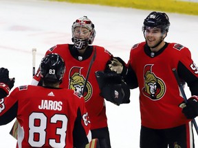 Ottawa Senators goaltender Craig Anderson (41) and teammates Christian Jaros (83) and Magnus Paajarvi (56) celebrate their 6-2 win over the San Jose Sharks in Ottawa on Saturday, Dec. 1, 2018. It was the Senators' third straight victory.